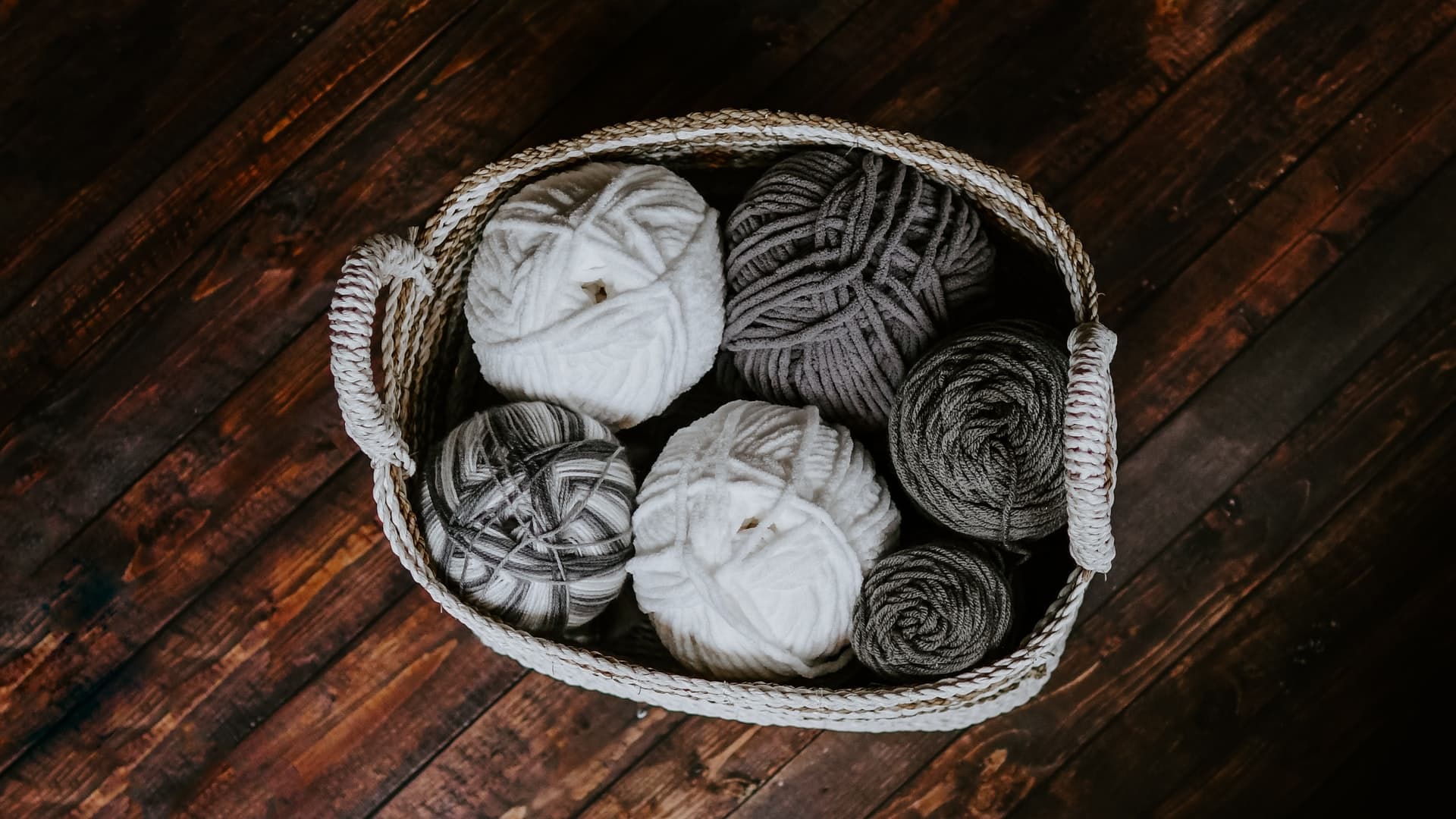 white and brown yarn in basket